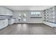 Living room with white cabinets, access to backyard, and large windows at 4143 Chela Cir, Las Vegas, NV 89120