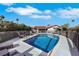 A private pool and spa with lounge seating creates an inviting backyard oasis at 4143 Chela Cir, Las Vegas, NV 89120