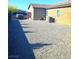 Large backyard with desert landscaping and privacy landscaping, and fenced in utility area at 42 Late Harvest Ave, Pahrump, NV 89060