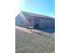 Spacious backyard showcasing desert landscape, covered patio, and outdoor dining area at 42 Late Harvest Ave, Pahrump, NV 89060