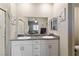 Stylish bathroom boasts double sinks, granite counters, and a connecting shower at 42 Late Harvest Ave, Pahrump, NV 89060