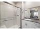 Bathroom features a glass-enclosed shower, granite countertop, and white subway tile at 42 Late Harvest Ave, Pahrump, NV 89060