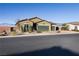 Charming single-story home featuring a well-kept yard and a spacious three-car garage at 42 Late Harvest Ave, Pahrump, NV 89060