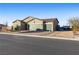 Lovely one-story home with a three car garage, desert landscaping, and space for RV parking at 42 Late Harvest Ave, Pahrump, NV 89060