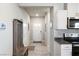 Hallway with a view of the front door and access to the kitchen area at 42 Late Harvest Ave, Pahrump, NV 89060
