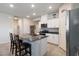Bright kitchen featuring white cabinets, granite countertops, and stainless steel appliances at 42 Late Harvest Ave, Pahrump, NV 89060