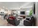 Open concept living area with a view of the kitchen and comfortable seating at 42 Late Harvest Ave, Pahrump, NV 89060