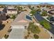 An aerial shot showcasing the home, landscaping, and a residential street view at 4308 Brazil Palm Ct, North Las Vegas, NV 89032