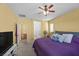 Bright bedroom with ceiling fan, ensuite bathroom, closet and carpeting with an overall cozy feel at 4308 Brazil Palm Ct, North Las Vegas, NV 89032