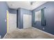 Bedroom features neutral carpet, blue walls, closet and natural light at 4308 Brazil Palm Ct, North Las Vegas, NV 89032