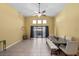 Bright dining room area with tile flooring, modern furnishings, and sliding glass doors to the backyard at 4308 Brazil Palm Ct, North Las Vegas, NV 89032