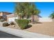 Single-story home with three-car garage, xeriscaping, and a small fenced patio at 4308 Brazil Palm Ct, North Las Vegas, NV 89032