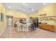 Bright, open kitchen boasts a large island with seating and an adjacent counter with open display shelves at 4308 Brazil Palm Ct, North Las Vegas, NV 89032