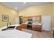 Kitchen with a white countertop island, stainless steel appliances, and ample cabinet space at 4308 Brazil Palm Ct, North Las Vegas, NV 89032