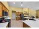 Well-equipped kitchen featuring a central island, stainless steel appliances, and ample cabinet space at 4308 Brazil Palm Ct, North Las Vegas, NV 89032