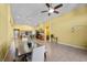 Spacious living room with dining area, tile flooring, and views of the kitchen at 4308 Brazil Palm Ct, North Las Vegas, NV 89032