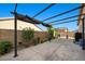 Outdoor patio featuring an open pergola, concrete and desert landscaping at 4308 Brazil Palm Ct, North Las Vegas, NV 89032
