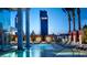 Luxury pool area with stylish lounge chairs, palm trees, and views of The Palms tower at 4381 W Flamingo Rd # 1508, Las Vegas, NV 89103