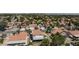 Scenic aerial view showcases a suburban neighborhood with terra cotta roofs and the Las Vegas skyline in the distance at 459 Kelsford Dr, Las Vegas, NV 89123