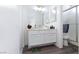 Bathroom featuring a white vanity, large mirror, and toilet next to frosted glass shower at 459 Kelsford Dr, Las Vegas, NV 89123