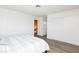 Bright bedroom featuring white walls, wood-look flooring, and closet with sliding doors at 459 Kelsford Dr, Las Vegas, NV 89123