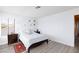 A bright bedroom offers a large window, modern flooring, and simple decor at 459 Kelsford Dr, Las Vegas, NV 89123