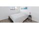 Bedroom featuring wood-look flooring, small window, and lamp on side table at 459 Kelsford Dr, Las Vegas, NV 89123