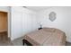 Inviting bedroom features a comfortable bed and a spacious closet with sliding doors providing ample storage at 459 Kelsford Dr, Las Vegas, NV 89123