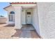 A covered front porch leads to the front door and is surrounded by low maintenance landscaping at 459 Kelsford Dr, Las Vegas, NV 89123