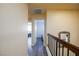 Hallway featuring wood-look flooring, staircase, and access to bedrooms at 459 Kelsford Dr, Las Vegas, NV 89123