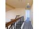 The upper hallway has modern floors, and a wood-stained railing at 459 Kelsford Dr, Las Vegas, NV 89123