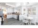 Bright kitchen features white cabinets, stainless steel appliances, and an adjacent dining area at 459 Kelsford Dr, Las Vegas, NV 89123