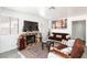 A cozy living room features a fireplace, artwork, and comfortable seating at 459 Kelsford Dr, Las Vegas, NV 89123
