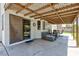 Comfortable covered patio with cozy seating, ideal for relaxing and enjoying the outdoor living space at 459 Kelsford Dr, Las Vegas, NV 89123