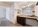 Bathroom boasts granite counters, vanity with seating area, and shower over tub at 4610 Lime Straight Dr, Las Vegas, NV 89115