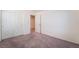 Bedroom featuring double door closet, plush carpeting, and ensuite bathroom entrance at 4610 Lime Straight Dr, Las Vegas, NV 89115