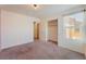 Bedroom featuring plush carpets, bright walls and ensuite entrance at 4610 Lime Straight Dr, Las Vegas, NV 89115