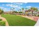Lush lawn area featuring a picnic shelter and landscaped greenery at 4610 Lime Straight Dr, Las Vegas, NV 89115