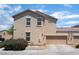Two story home featuring an attached garage with neutral stucco and tile roof at 4610 Lime Straight Dr, Las Vegas, NV 89115