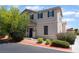Charming two-story home featuring a well-maintained yard and neutral stucco exterior at 4610 Lime Straight Dr, Las Vegas, NV 89115