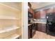 Walk-in pantry and kitchen with granite counters, and modern appliances at 4610 Lime Straight Dr, Las Vegas, NV 89115