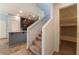 Staircase view of kitchen featuring granite countertops and modern appliances at 4610 Lime Straight Dr, Las Vegas, NV 89115