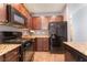 A kitchen featuring granite counters, tile floors, and modern appliances at 4610 Lime Straight Dr, Las Vegas, NV 89115