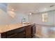 Bright kitchen island featuring a stainless sink, granite countertops, and tile floors at 4610 Lime Straight Dr, Las Vegas, NV 89115