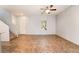 Open living room with tile floors, ceiling fan, stairs, and a bright, airy feel at 4610 Lime Straight Dr, Las Vegas, NV 89115