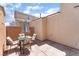 Charming patio with comfortable seating, stone pavers and partial shade at 4610 Lime Straight Dr, Las Vegas, NV 89115