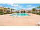 Bright swimming pool surrounded by lounge chairs and palm trees providing a relaxing oasis at 4610 Lime Straight Dr, Las Vegas, NV 89115