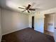 Cozy bedroom featuring neutral walls, carpeted floor, ceiling fan, and closet at 5260 Mission Monterey Ln # 208, Las Vegas, NV 89107