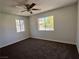 Spacious bedroom with two windows offering natural light and neutral-toned walls at 5260 Mission Monterey Ln # 208, Las Vegas, NV 89107