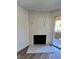 Close-up of the contemporary fireplace with its striking marble tile and sliding glass door at 5260 Mission Monterey Ln # 208, Las Vegas, NV 89107